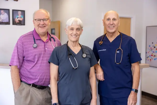 Veterinarians posing together in the exam area at Dr. Dan’s Animal Hospital in Vero Beach, FL.